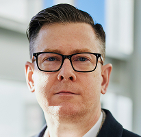 Retrato de Alexander Hughes, CEO e executivo de empresa de trading de criptomoedas